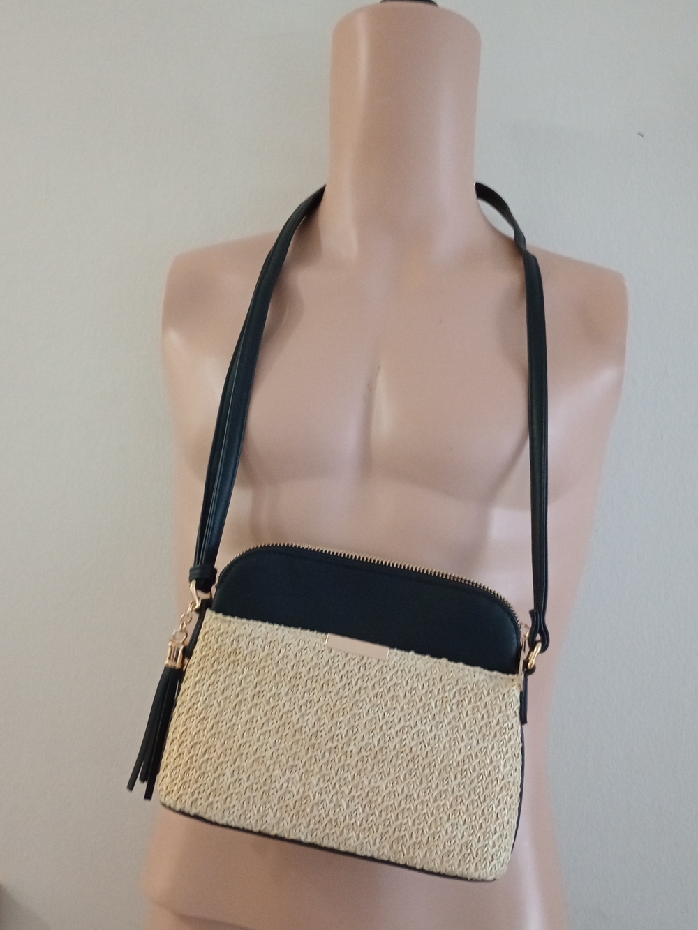 Thacker Shay camera crossbody bag featuring woven straw and leather trim.